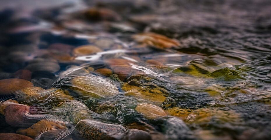 water running over river rocks