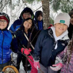 group of kids in forest in winter time